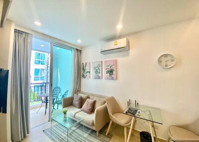 Bright and modern living room with sliding door to balcony