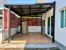 Spacious covered patio area adjacent to the house