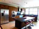 Modern kitchen with stainless steel appliances and center island