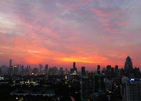 Stunning cityscape at sunset with vibrant skies