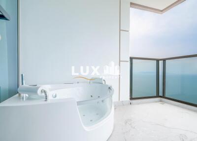 Luxurious bathroom with a Jacuzzi and panoramic sea view