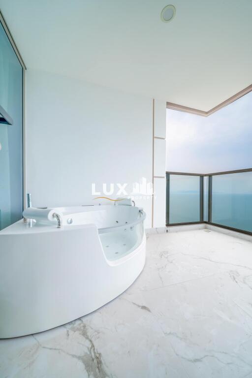 Luxurious bathroom with a Jacuzzi and panoramic sea view