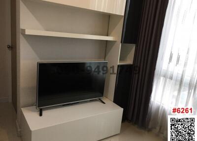 Modern living room interior with television and shelving