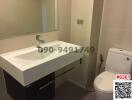 Modern bathroom interior with sink and toilet