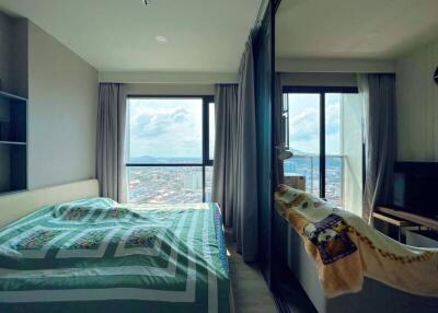 Cozy bedroom with city view and ample natural light