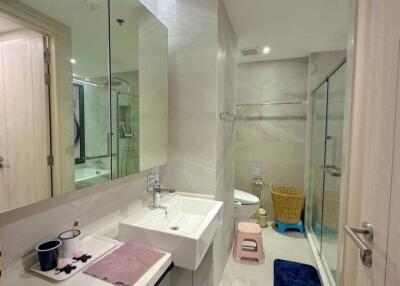 Modern bathroom interior with shower and mirrored vanity