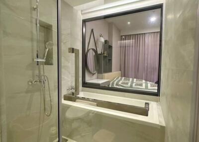 Modern bathroom with glass shower and stylish fixtures