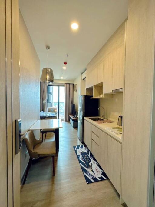 Compact apartment interior with integrated kitchen and dining area