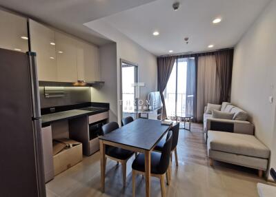 Modern apartment interior with integrated dining and living area