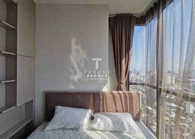 Modern Bedroom with Large Window and City View