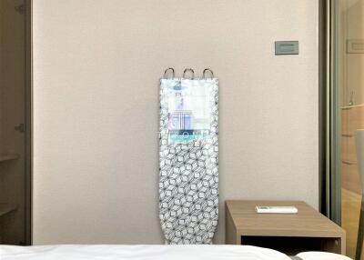 Bedroom with ironing board