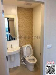 Compact bathroom with toilet and sink