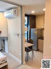 Compact and fully-furnished studio apartment with kitchen and dining space