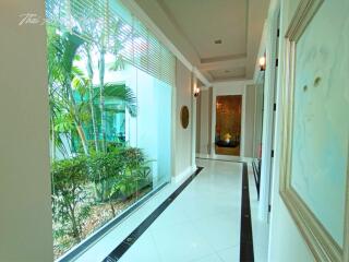 Bright corridor with indoor garden and elegant floor design