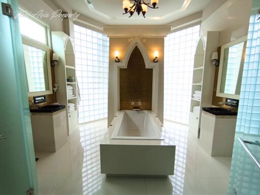 Luxurious spacious bathroom with bathtub and stylish fixtures