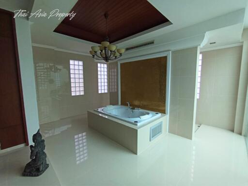 Spacious bathroom with jacuzzi and elegant finish