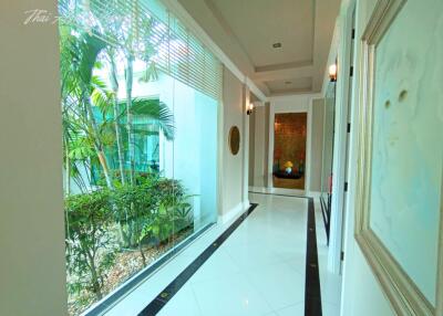 Bright and spacious corridor with garden view and elegant interior