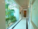 Bright and spacious corridor with garden view and elegant interior
