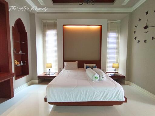 Elegant bedroom with large bed and modern decor