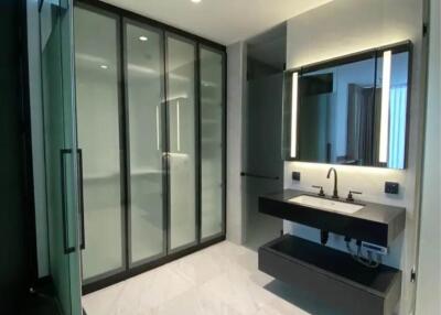 Modern bathroom with shower cabin and vanity area