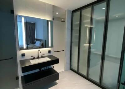 Modern bathroom interior with glass shower and double sink vanity