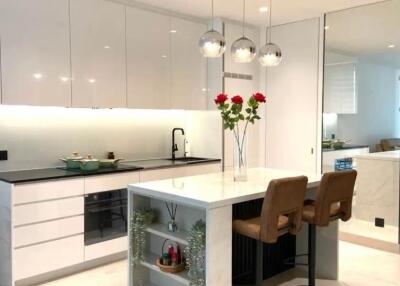 Modern kitchen interior with island and pendant lights