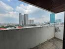 City view from an apartment balcony with high rises in the distance