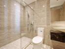 Modern bathroom with glass shower enclosure and elegant finishes