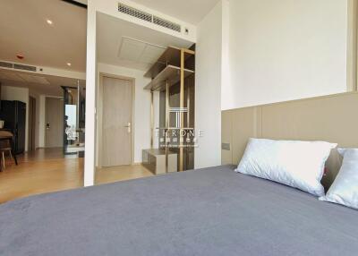 Modern bedroom interior with a view of the living area