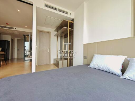 Modern bedroom interior with a view of the living area