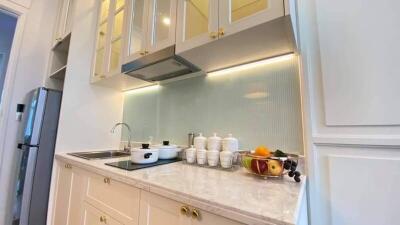 Modern kitchen with stainless steel appliances and white cabinetry