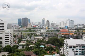 Cityscape view from a high-rise building showing residential and commercial areas