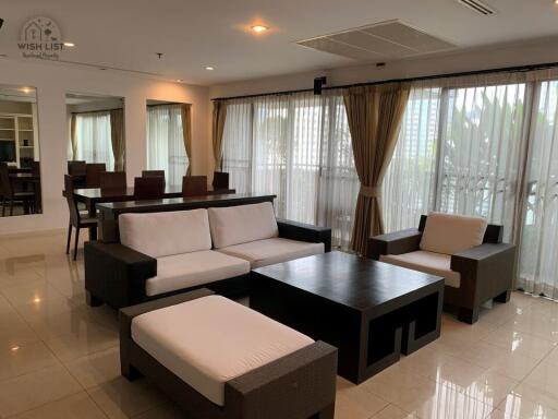 Spacious furnished living room with adjoining dining space