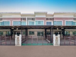 Modern townhouses with balconies and carports