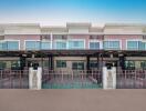 Modern townhouses with balconies and carports