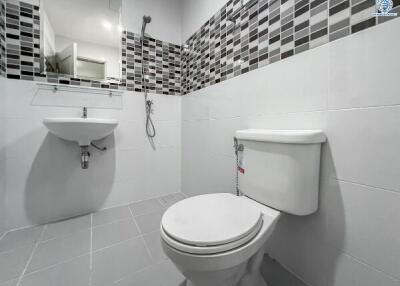 Modern white bathroom with decorative tiles