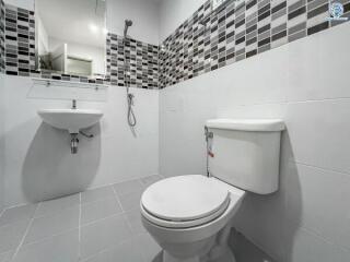 Modern white bathroom with decorative tiles