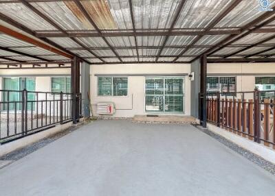 Spacious garage with metal roof and large windows
