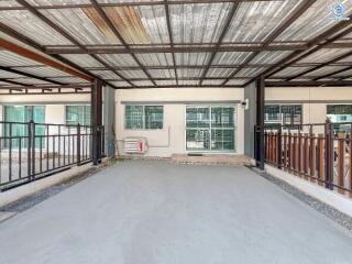 Spacious garage with metal roof and large windows