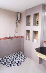 Modern bathroom with decorative tiling