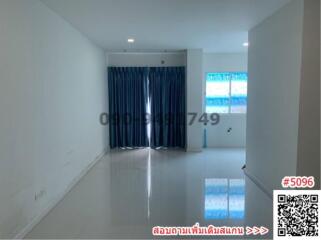 Spacious and bright empty living room with large windows and tiled flooring