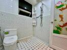 Modern bathroom with decorative tiles and shower