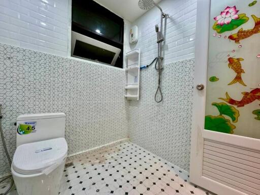 Modern bathroom with decorative tiles and shower