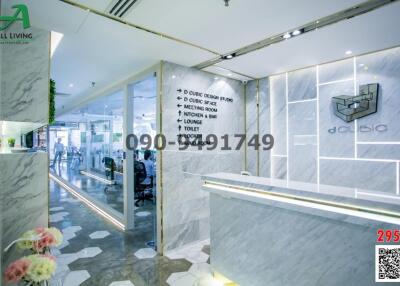 Modern reception area with marble walls and floor signage