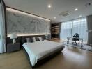 Spacious modern bedroom with large bed and artistic wall panel