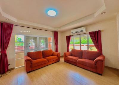 Spacious living room with lots of natural light and comfortable seating