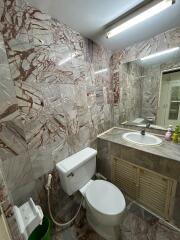 Marbled bathroom with modern fixtures