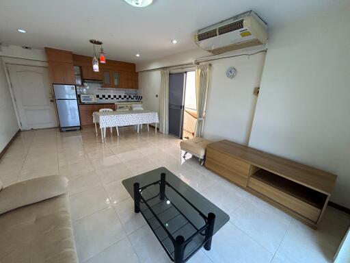 Spacious open-plan living room with kitchen and modern appliances