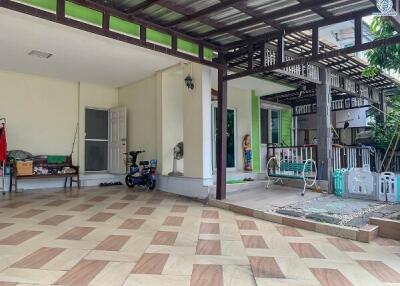 Spacious covered porch area with tiled flooring