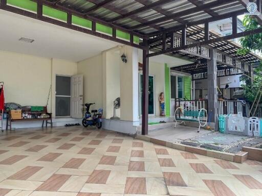 Spacious covered porch area with tiled flooring